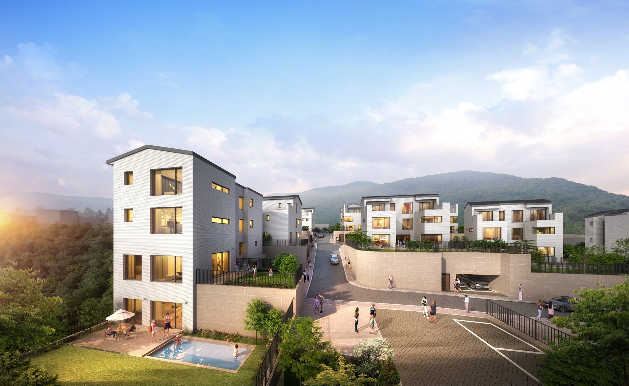 능평동 14세대 단지 부지 전경 — 숲에 둘러싸인 평탄한 필지
